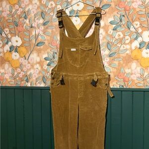 Corduroy Mumsie baby wearing Overalls in Mustard